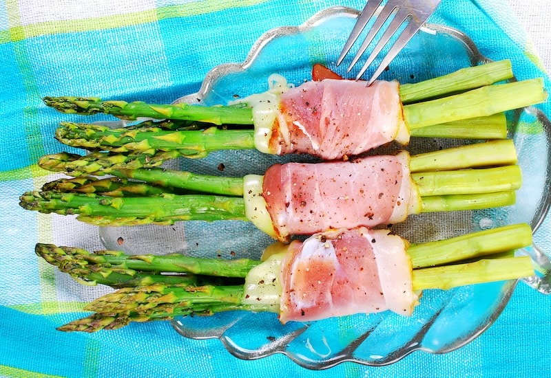 Asparagus spears wrapped in ham