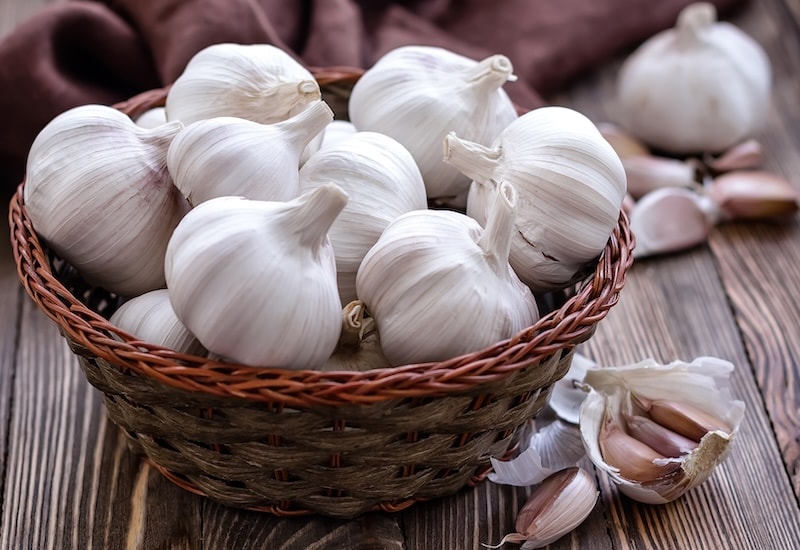 White garlic cloves in basket
