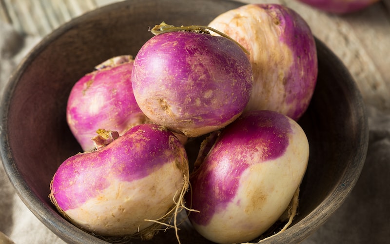 Bowl of purple and white turnips