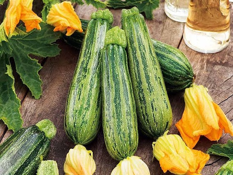 Striped courgette on table